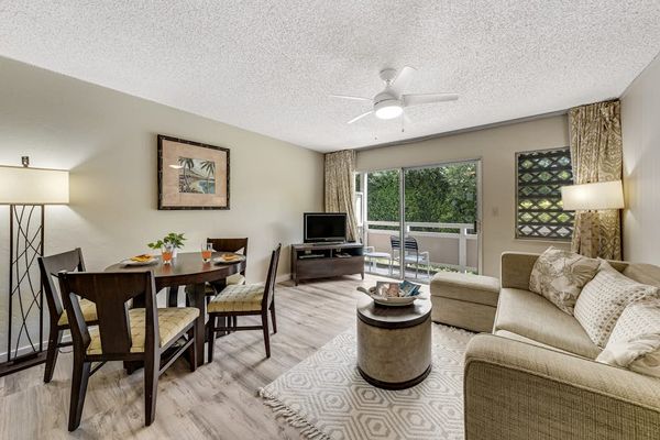Open Living and Dining Area featuring Wooden Dining Set and Comfortable Seating