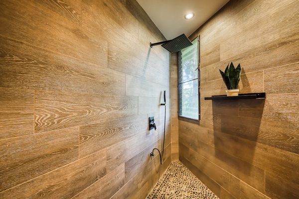 Modern walk-in shower with elegant finishes