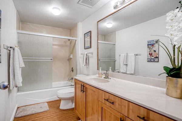 Full bathroom with vanity and walk-in shower