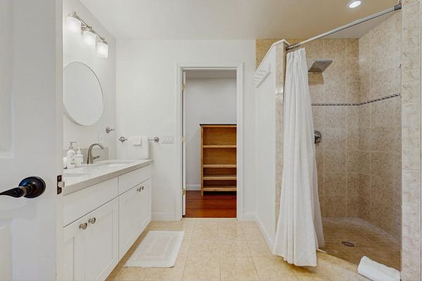 Full bathroom with walk in tile shower