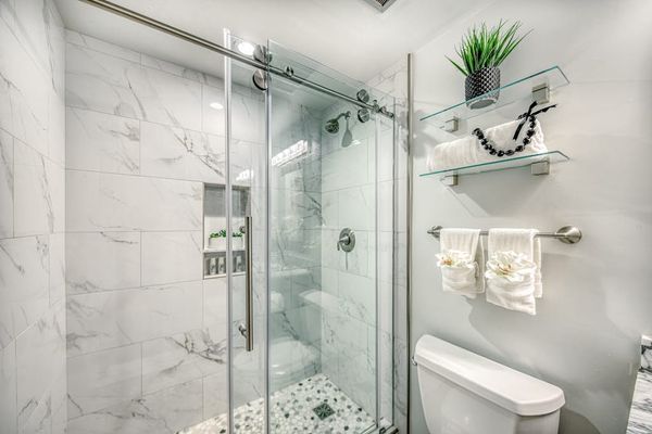 Spacious Walk-In Shower With Marble Details