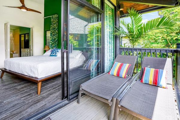 Private Covered Balcony with Sun Loungers Adjacent to Primary Bedroom