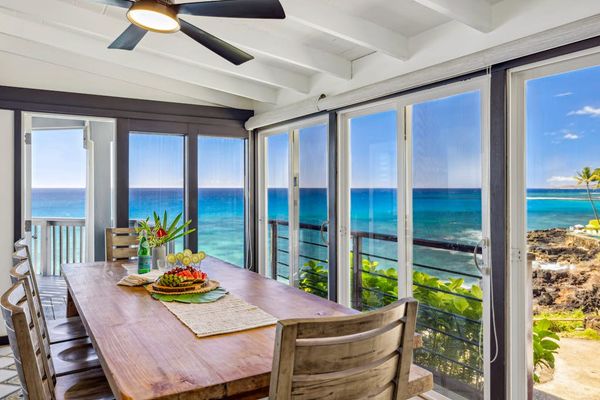 Dining room with panoramic views of the tropical paradise, with seating for ten.