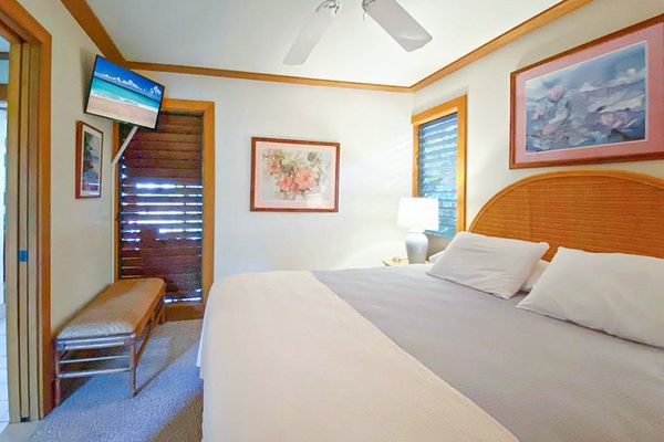 Master bedroom with king bed and a flat screen tv for a relaxing evening.