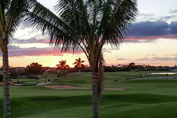 Golden Sunset Over Tropical Fairways