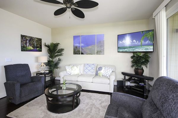 Settle into the bright living room, where you can put your feet up on the couch and two chairs to watch movies on the flatscreen TV. Extra guests? The couch doubles as a queen sleeper sofa. Large picture windows and sliding doors.