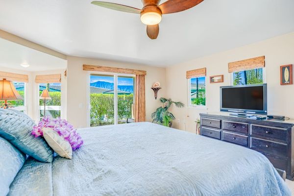 Main floor spacious master bedroom with king bed, en suite, flat screen tv and private lanai access.