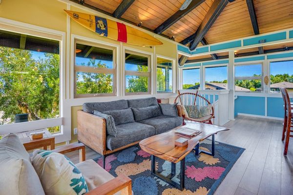 Living room with panoramic views comfortable seating and a flat screen tv.