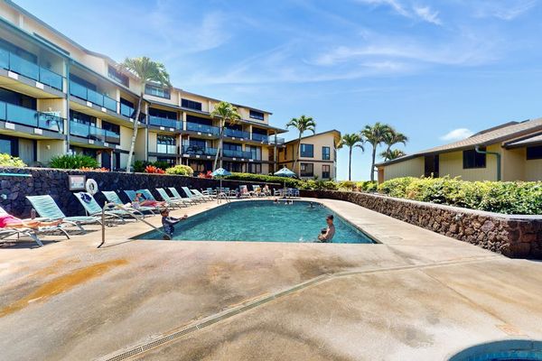 Sparkling Outdoor Pool Set Against Tropical Landscaping