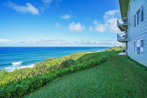 Expansive oceanfront lawn with sweeping views of the coastline