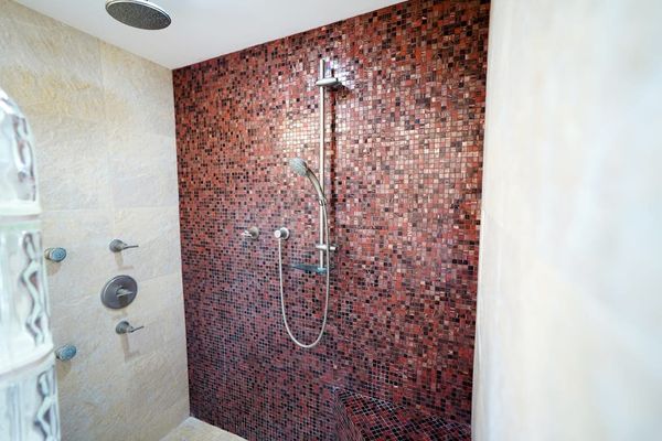 Spa-like primary bathroom with modern tilework