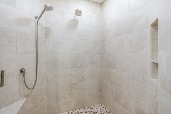 Elegant walk-in shower with modern finishes