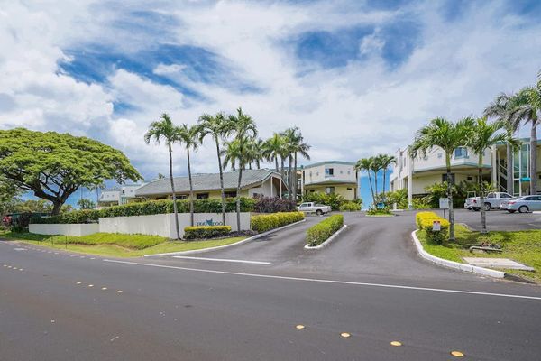 A welcoming entrance surrounded by lush tropical landscaping