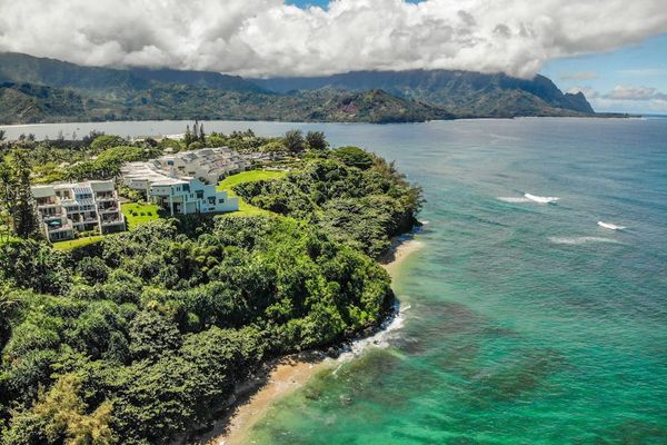 Aerial view of the oceanfront resort surrounded by tropical beauty