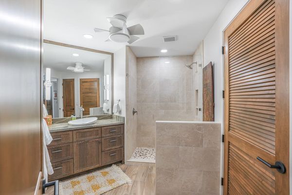 Modern guest bathroom with dual vanities and elegant finishes