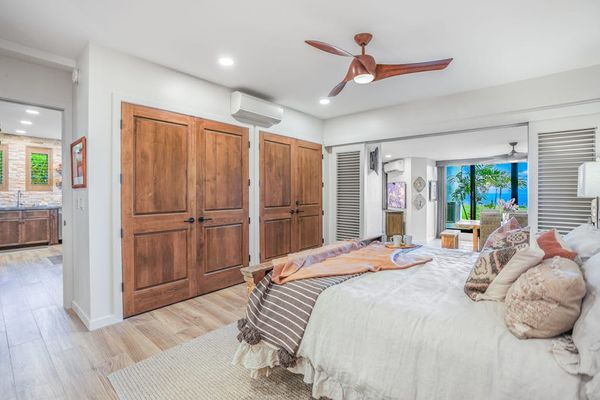 Cozy guest bedroom with ample storage and natural light