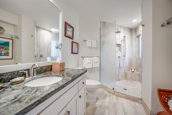 Spacious bathroom with a double vanity and elegant finishes.