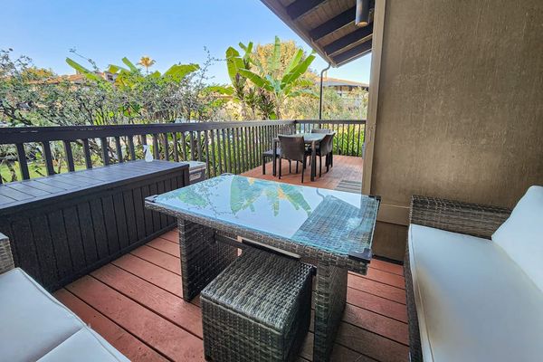 Enjoy lush tropical views from your lanai, complete with outdoor seating perfect for dining or evening drinks.