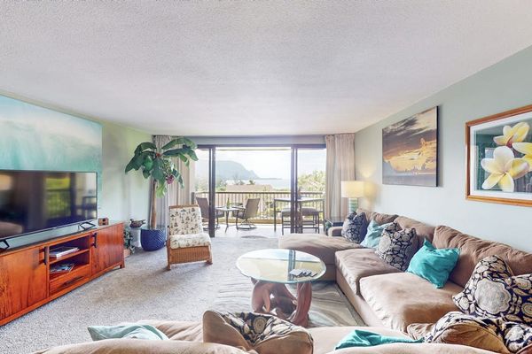 Bright lounge blends island decor comfortable seating and balcony views
