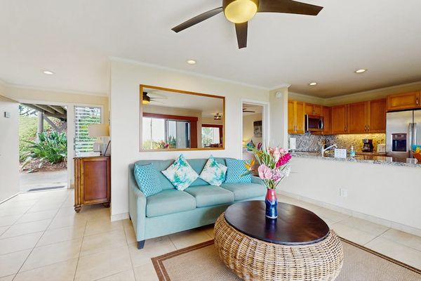 Open lounge connects relaxed furnishings with windows and island scenery