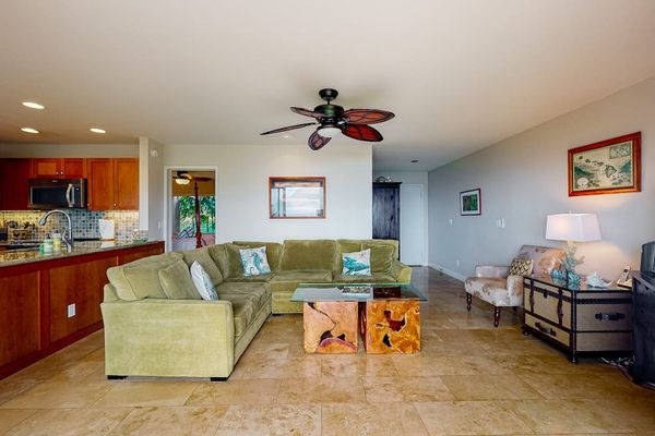 Bright living room showcases ocean views, woven accents, and seating