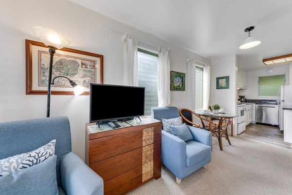 Comfortable living room with Smart TV and cozy seating.