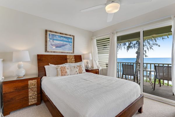 Bright bedroom with direct access to the private oceanfront lanai.