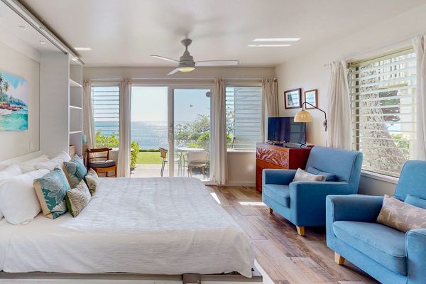 Spacious studio with comfortable seating and stunning oceanfront views.