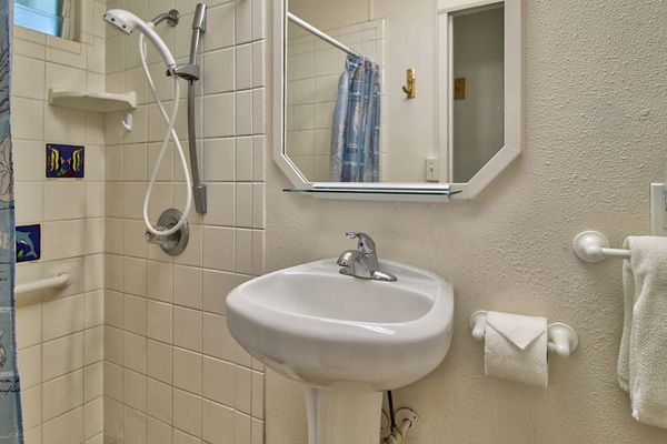 Well-appointed full bathroom with shower and everyday essentials.