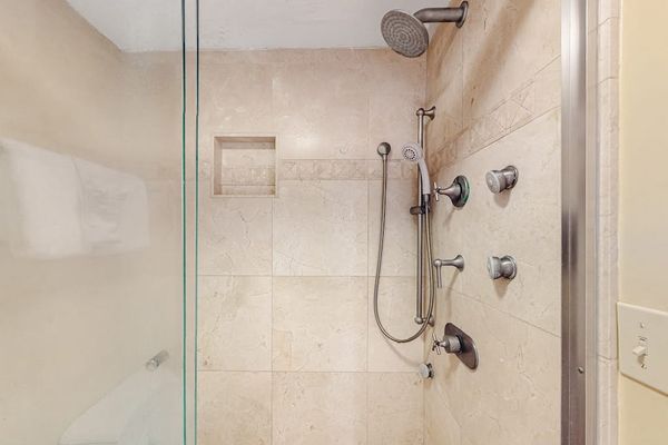 Refresh comfortably in this spacious walk-in shower after beach adventures