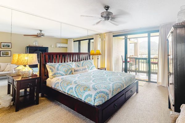 Rest comfortably in this welcoming bedroom with refreshing outdoor views