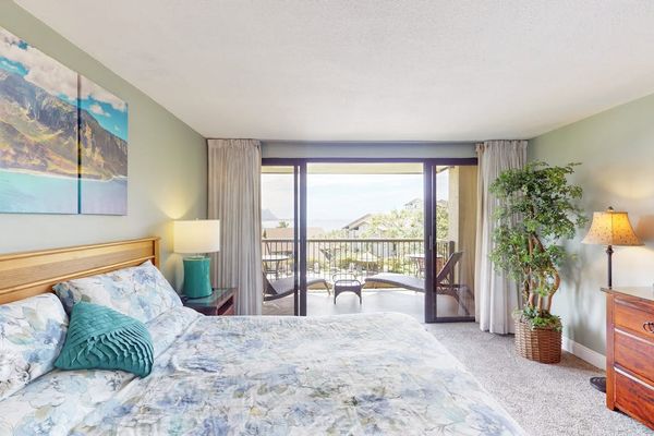 Relax in this bright bedroom overlooking beautiful tropical island scenery