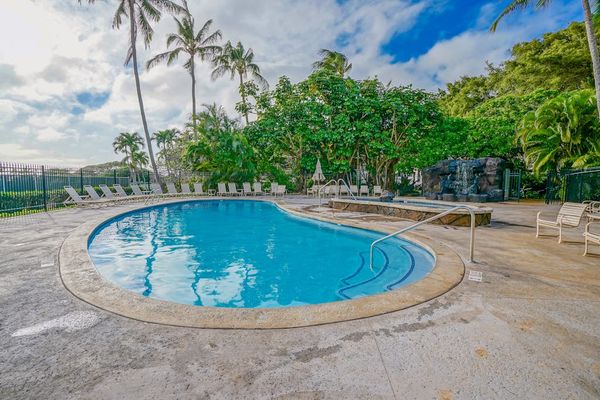 Resort Swimming Pool Area featuring Decorative Waterfall Feature