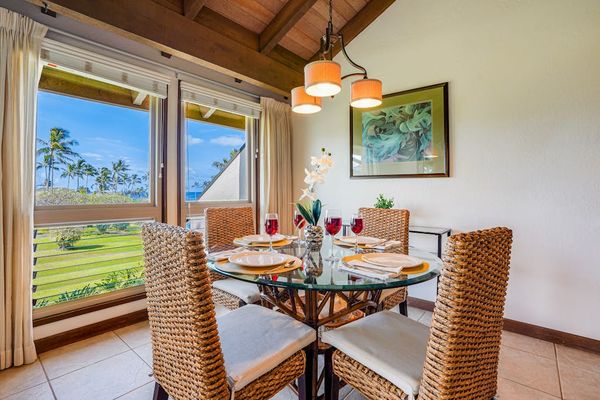 Scenic Dining Nook with Large Windows Overlooking Lush Greenery