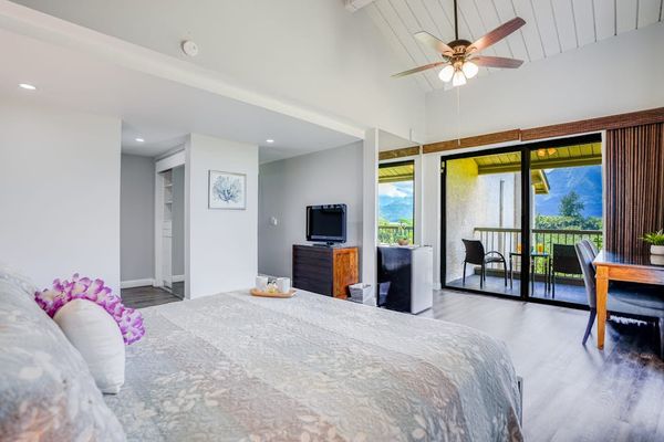 Bright bedroom offers plenty of space for relaxing vacation mornings
