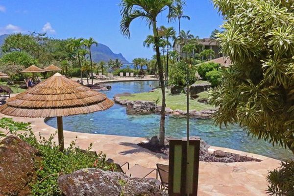 Refresh by the peaceful pool surrounded by lush tropical landscaping