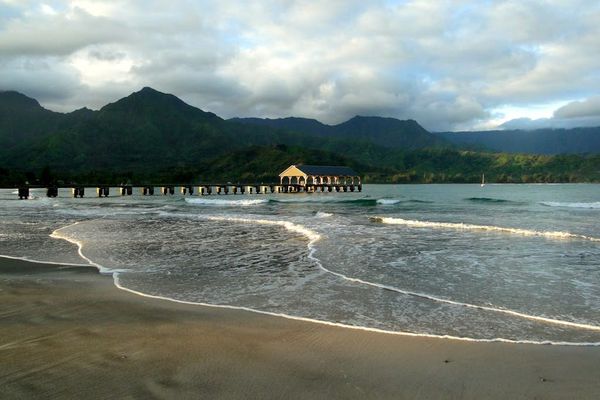 Enjoy beautiful shoreline views backed by dramatic lush mountain scenery