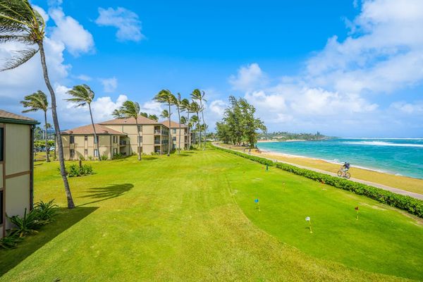 Expansive Beachfront Grounds Under Blue Skies