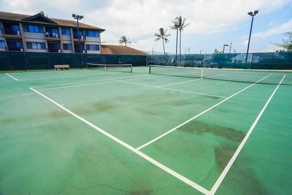 Sunny Tennis Court For Active Getaways