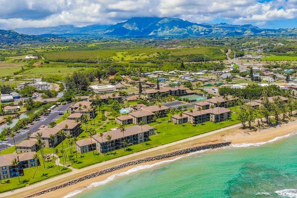 Aerial Coastal View With Mountain Backdrop