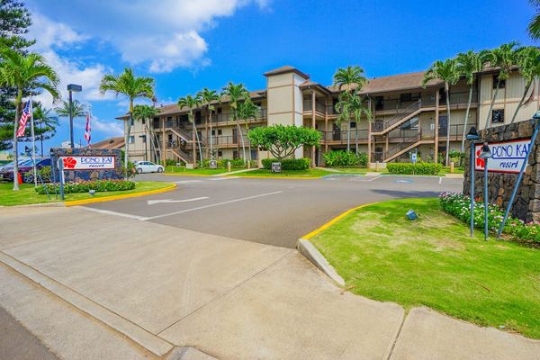Welcoming Resort Entrance With Tropical Landscaping