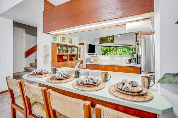 Four barstools for extra seating at the kitchen counter.