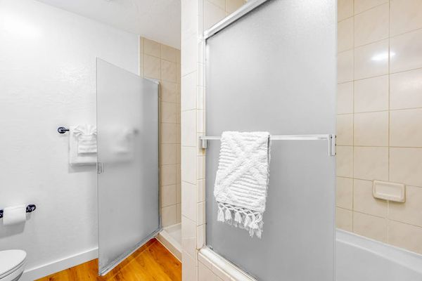 Bright Full Bathroom With Walk In Shower