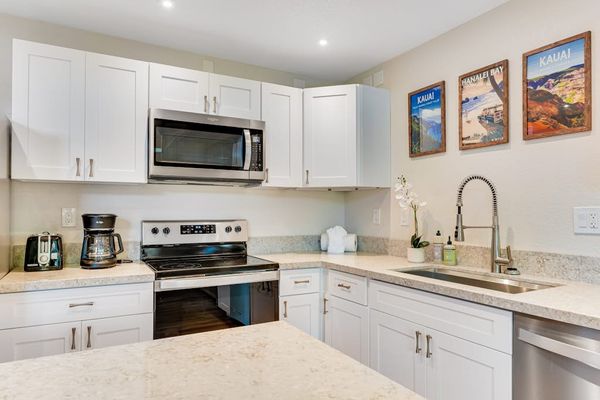 Spacious stainless steel kitchen with an open-concept design, allowing you to enjoy abundant natural light while staying connected with family and friends.