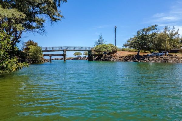 Pono Kai Resort, includes 12-acre grounds, an outdoor pool, a hot tub, a shuffleboard area, a barbecue facility with gas grills, a sauna, golf putting greens, Ping-Pong tables, a croquet lawn, a fitness center, tennis courts, and laundry facilities.