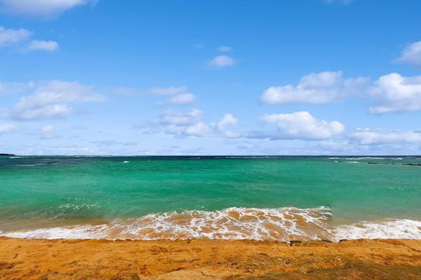Gaze out over the crashing waves on to the white sandy beaches.