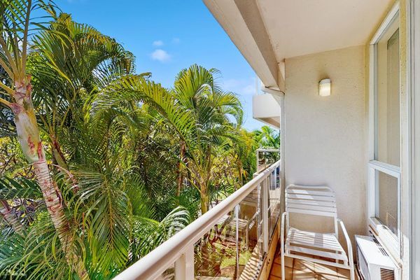 Covered lanai framed by lush greenery
