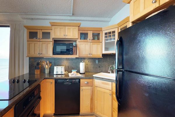 Fully stocked kitchen open to the rest of the unit with this open concept feel, lots of natural light.