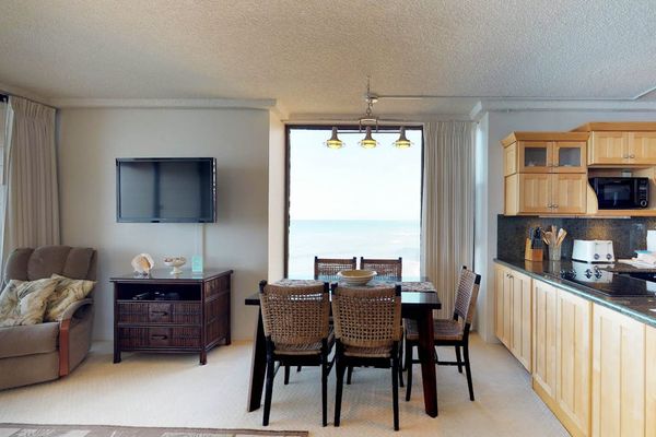 Dining room with seating for five and open to the living room.
