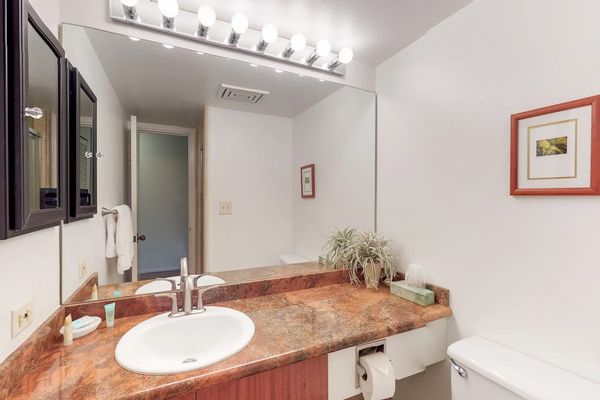 Spacious bathroom counter with a large mirror